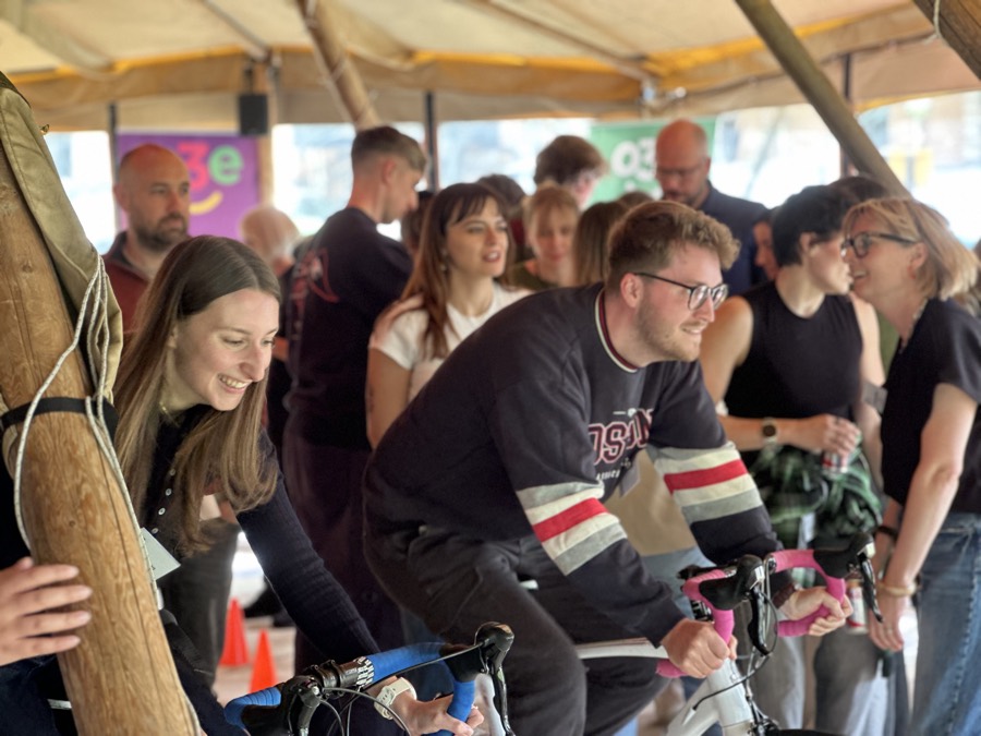 A room full of people building bikes together